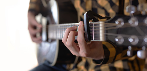 Acoustic Guitar Playing. Young men Playing Acoustic Guitar