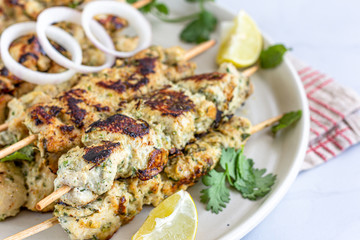 Indian Chicken Tikka Close Up Photo. Chicken Malai Tikka on Skewers.