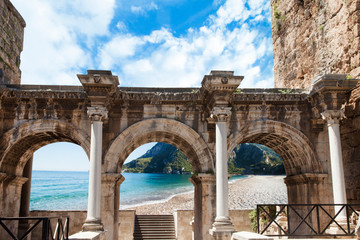 Welcome to amazing Antalya concept. Collage of famous landmarks: Hadrian's Gate old town Kaleici district and Konyaalti beach in popular resort city Antalya, Turkey