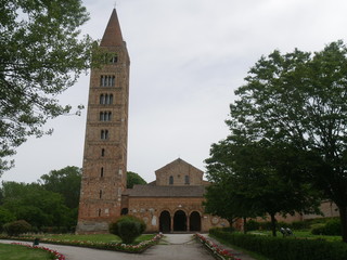 Fototapeta premium Pomposa Abbey is a Benedictine monastery built in Romanesque style on the Adriatic coast of Italy. It is famous for the Carolingian manuscripts preserved in its library founded by abbot Girolamo and b