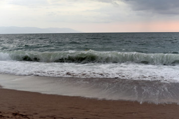 Fototapeta na wymiar Beach Sunset over Waves