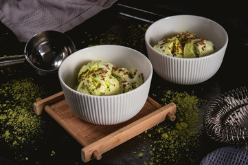 Homemade matcha green tea ice cream on dark background