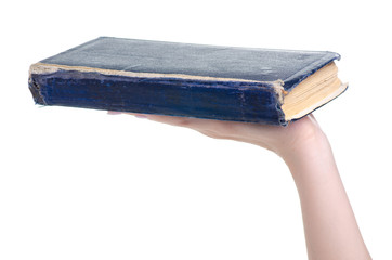 Old book in hand on white background isolation