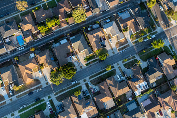 Aerial view of residential rooftops, streets and alleys in Los Angeles County California.
