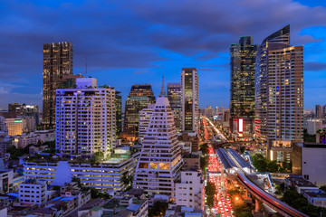 Bangkok business district cityscape with skyscraper at twilight, Thailand