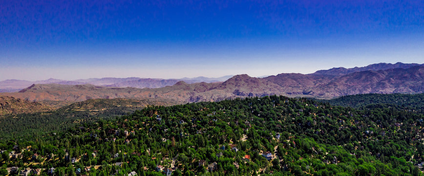 Aerial, panoramic, drone view of the high desert near Apple Valley and Hesperia from the San Bernarindo Mountains near Lake Arrowhead, California