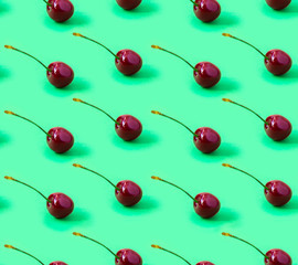 Seamless Cherry pattern on a green background