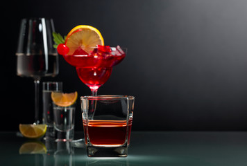 Various alcoholic drinks on a black background.