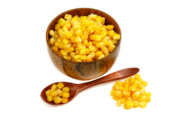 Corn seeds in a wooden spoon and cup (plate) isolated on white background