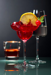 Various alcoholic drinks on a black background.
