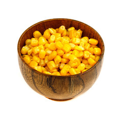 Corn seeds in a wooden spoon and cup (plate) isolated on white background