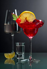Various alcoholic drinks on a black background.