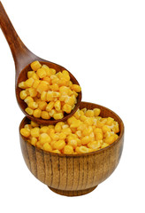 Corn seeds in a wooden spoon and cup (plate) isolated on white background