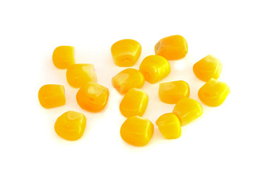 Yellow corn seeds isolated on white background close up. macro
