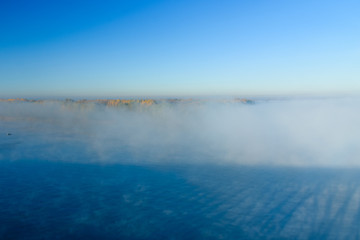 Fog over the water on a river Dnieper on autumn