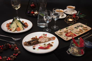 Tasty restaurant dishes: Cooked and stuffed crayfish, salad, appetizers, and crayfish ice-cream