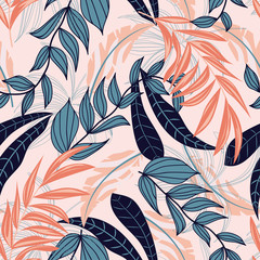 Abstract seamless background with colorful tropical leaves and bright plants on beige background. Vector design. Jungle print. Floral background. Printing and textiles. Exotic tropics. Fresh design.