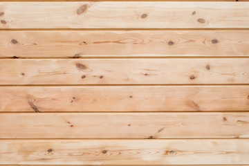 Fototapeta premium Wood Glued timber plank background. Wooden construction glued laminated timber in the wall of the house. Glued beams texture. Natural pattern pine wood background