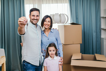 Happy family moving into their new home.