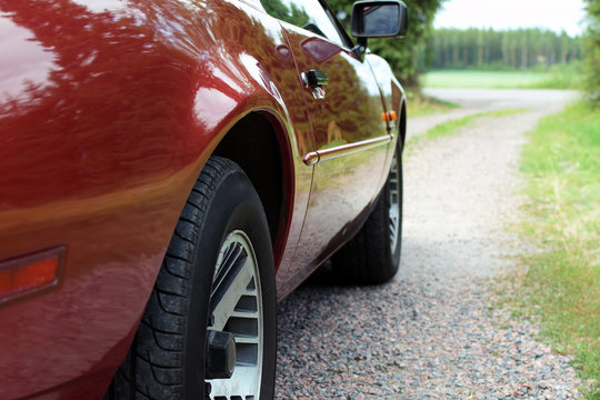 Side View Of Old Red Sports Car. Shallow Depth Of Field. Copy Space.