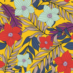 Trending bright seamless background with colorful tropical leaves and flowers on yellow background. Vector design. Jungle print. Floral background. Printing and textiles. Exotic tropics. Fresh design.