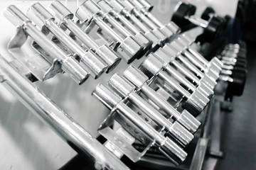 Sports dumbbells in fitness sports club. Weight Training Equipment