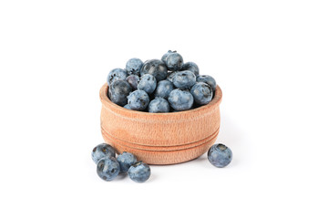 Wooden bowl with blueberries isolated on white background