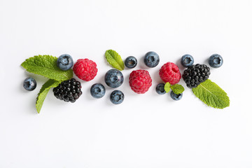 Flat lay composition with berries on white background, space for text