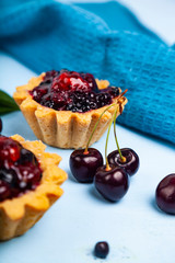 Small berry cake and ripe berries