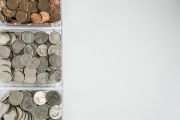 Organized loose coin change on left side, blank empty room space for text right