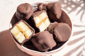 Frozen healthy dessert. Dark Chocolate Peanut Butter Banana Bites