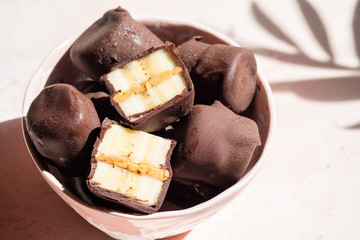 Frozen healthy dessert. Dark Chocolate Peanut Butter Banana Bites