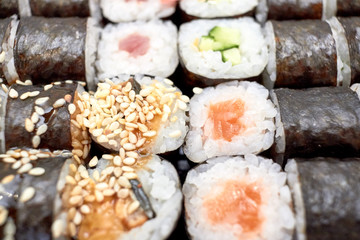 Sushi set. Set of different sushi with seafood. Sushi rolls with different fillings. A dish of traditional Japanese cuisine. Rolls with a variety of seafood. Rolls with oceanic fish and vegetables.