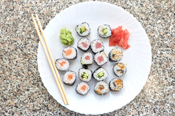 Sushi set. Set of different sushi with seafood. Sushi rolls with different fillings. A dish of traditional Japanese cuisine. Rolls with a variety of seafood. Rolls with oceanic fish and vegetables.