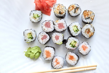 Sushi set. Set of different sushi with seafood. Sushi rolls with different fillings. A dish of traditional Japanese cuisine. Rolls with a variety of seafood. Rolls with oceanic fish and vegetables.