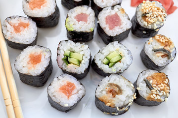 Sushi set. Set of different sushi with seafood. Sushi rolls with different fillings. A dish of traditional Japanese cuisine. Rolls with a variety of seafood. Rolls with oceanic fish and vegetables.