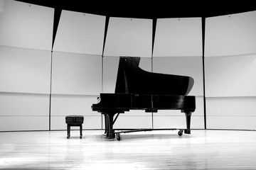 Black and White Piano on Concert Stage for Performance © Lane Erickson