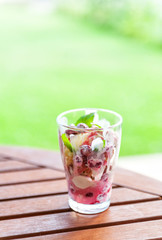Vanilla and strawberry ice cream with fresh fruits