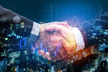 business man handshake with graph chart of stock market investment trading for Forex trading and night cityscape background, digital technology, internet communication, teamwork, partnership concept