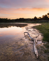lake in with beautiful colorful morning sunrise light reflected in the water.