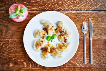 Fresh dumplings served on white plate