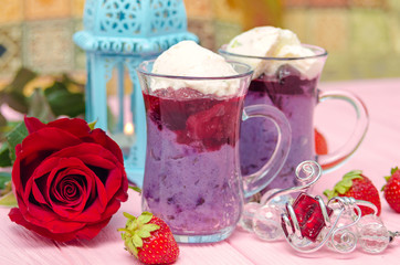 Mahalabia - Traditional Middle Eastern Dessert. Creamy dessert with berries and yogurt cream.