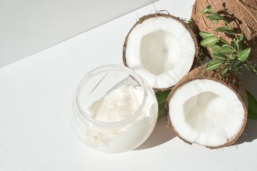 Coconut and cream in a jar with a green twig