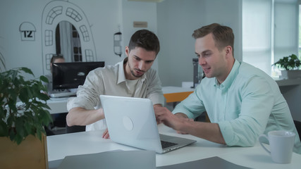 Men are brainstorming for search ideas future business development.Young professional team of coworkers.