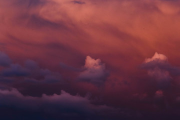 dark blue clouds on pink from sunset sky