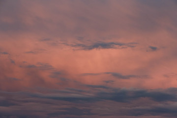 Obraz premium dark blue clouds on pink from sunset sky