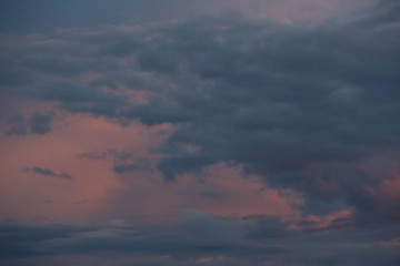 dark blue clouds on pink from sunset sky