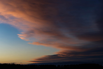 dark blue clouds on pink from sunset sky