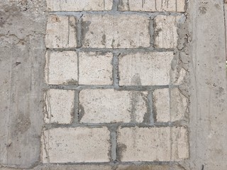 Rustic cement wall and gray blocks