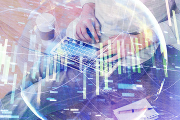 Double exposure of businessman working on laptop on background. International business hologram in front. Concept of success.